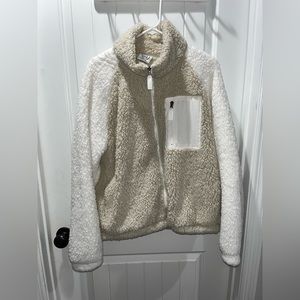 Very soft jacket. Zippers work great. Has a pocket.